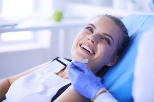 female patient at her dentist for Porcelain veneers in Orlando