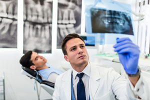 patient receiving restorative dentistry in Orlando FL as he visits the restorative dentist Orlando trusts