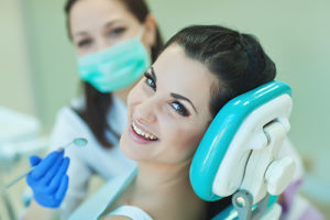 young woman receiving teeth whitening services in Orlando